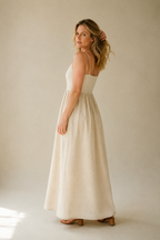 Ivory linen a-line maxi dress, three-quarter view, relaxed silhouette and natural drape