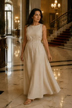 Beige linen a-line maxi dress, lifestyle, patio lounging in soft light