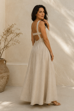 Beige linen a-line maxi dress, three-quarter view, relaxed fit and natural drape