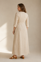 Beige linen wrap maxi dress, back view, smooth back with gentle drape