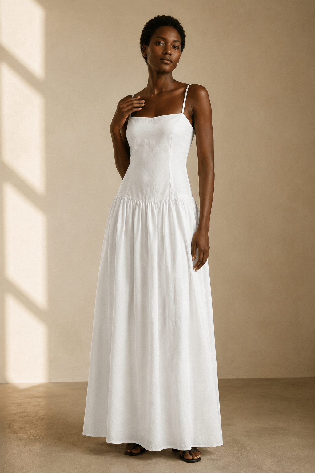 White cotton a-line maxi dress, full front view, fitted bodice and gathered maxi skirt