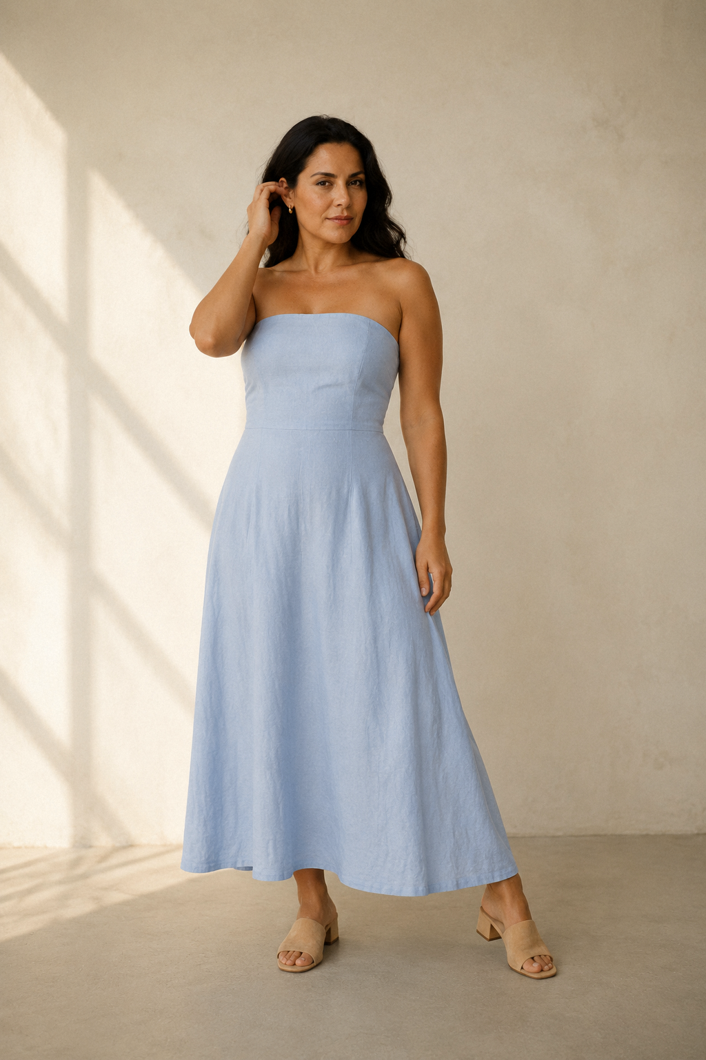Light blue linen a-line maxi dress, full front view, fitted bodice and flowing skirt