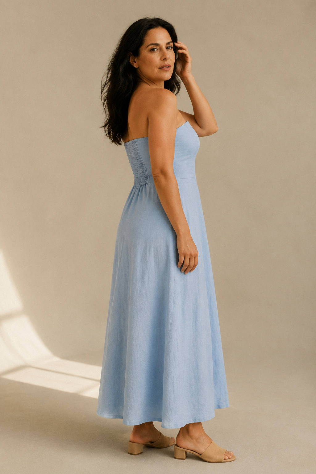 Light blue linen a-line maxi dress, three-quarter view, gentle skirt drape and waist seam