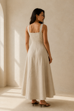 Beige linen a-line maxi dress, back view, clean lines and skirt volume