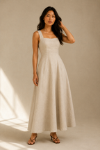 Beige linen a-line maxi dress, full front view, fitted bodice and flowing skirt