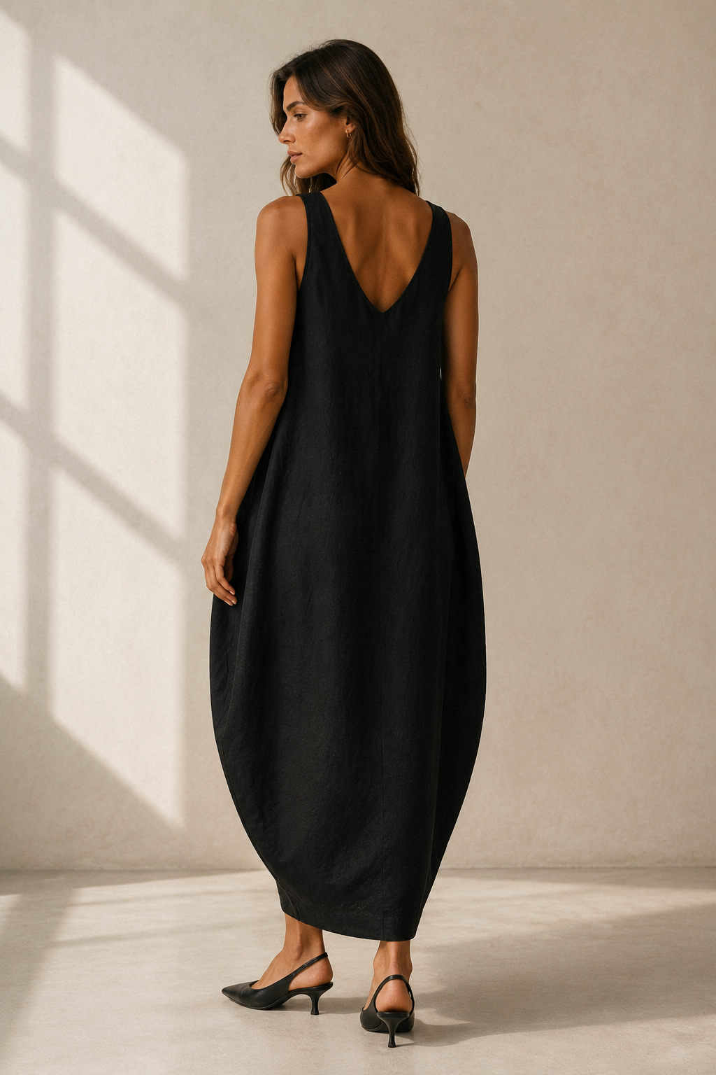 Black linen cocoon maxi dress, back view, relaxed drape and simple back