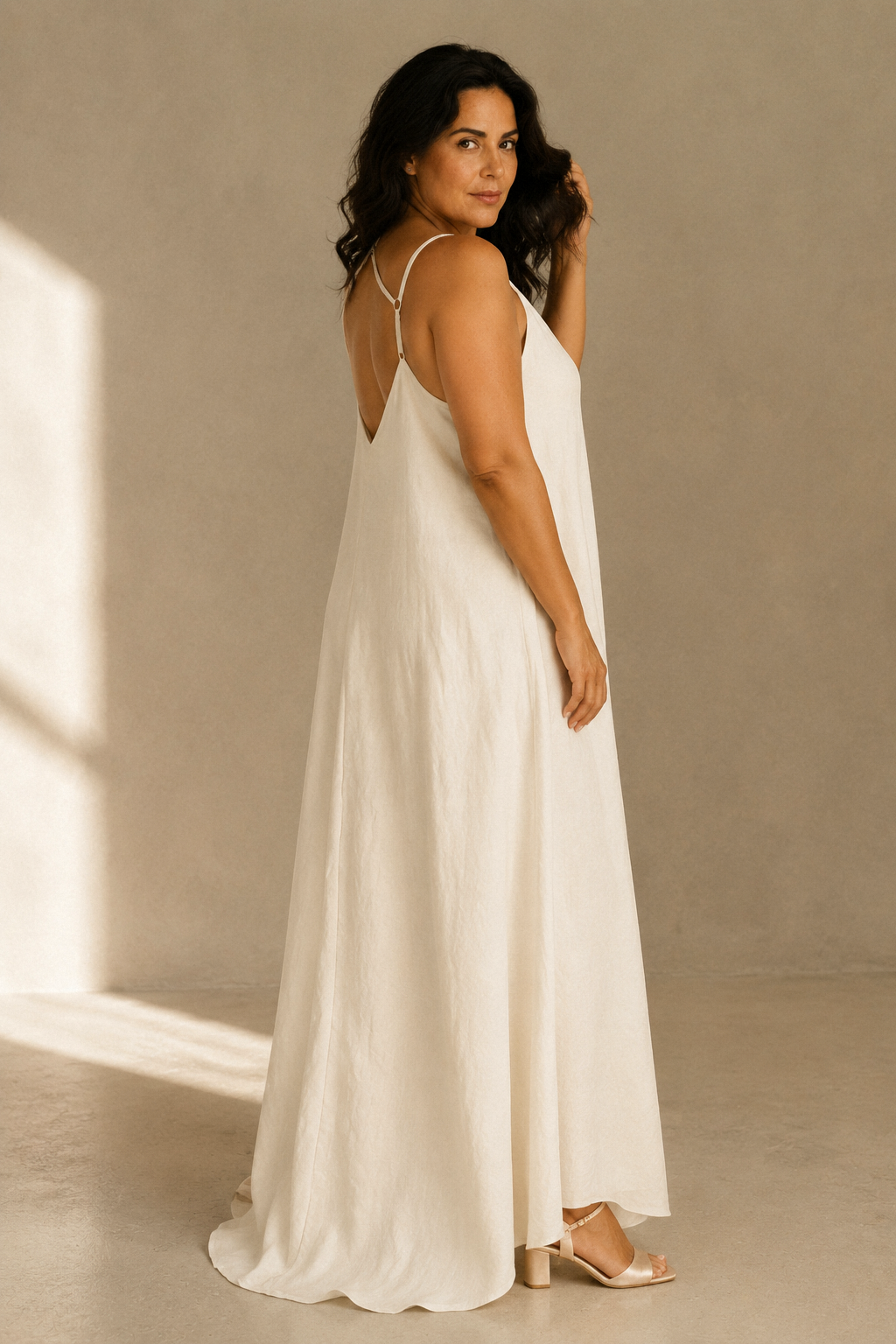 Ivory linen slip maxi dress, three-quarter view, soft fabric drape and relaxed fit