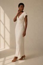 Ivory linen column maxi dress, three-quarter view, relaxed column fit and natural fabric drape