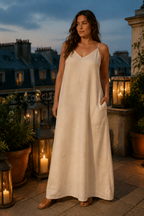 Ivory linen shift maxi dress, lifestyle, golden hour light on a warm day