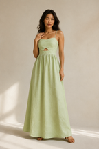 Light green linen a-line maxi dress, full front view, spaghetti straps, waist cut-out, full maxi skirt
