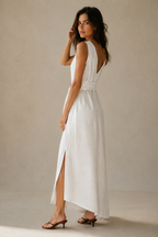 White linen wrap maxi dress, three-quarter view, wrap silhouette and flowing fabric