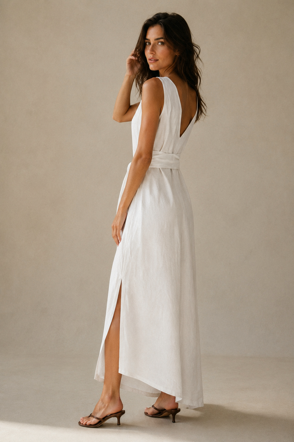 White linen wrap maxi dress, three-quarter view, wrap silhouette and flowing fabric