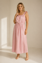 Light pink linen shift maxi dress, full front view, relaxed shift silhouette, side pockets