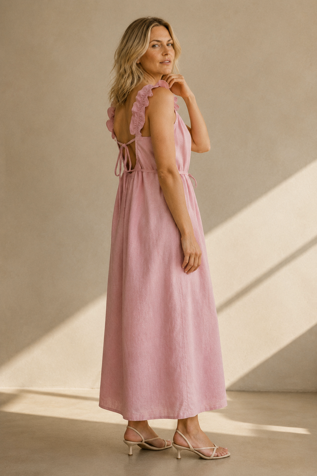 Light pink linen shift maxi dress, three-quarter view, flowing linen drape, casual elegance