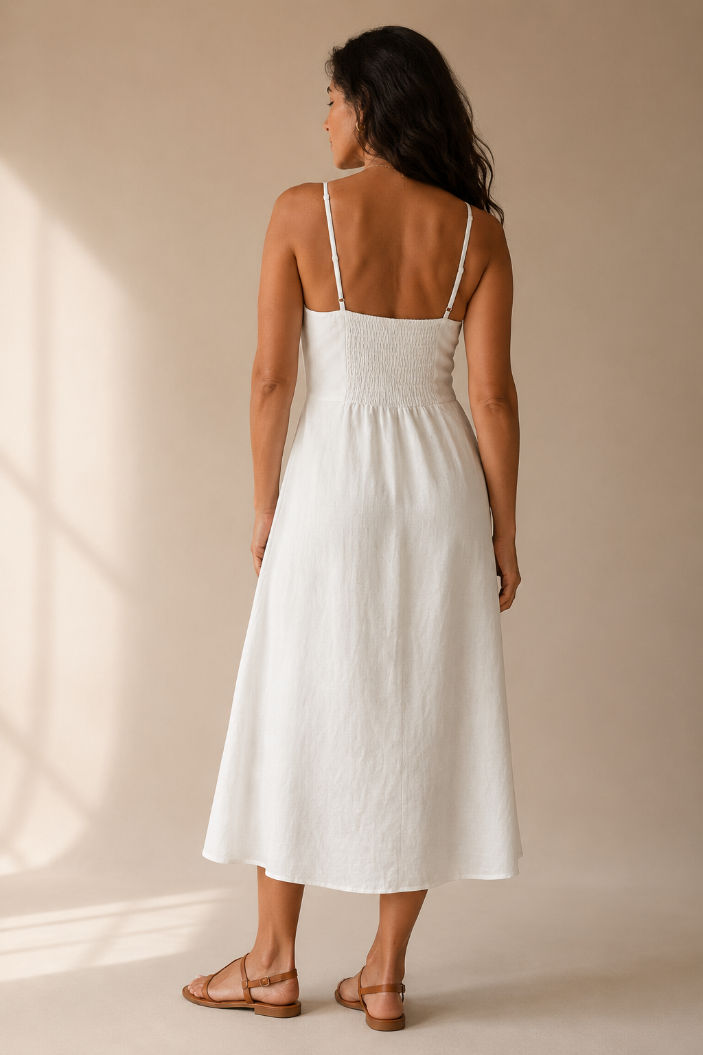 Ivory linen halter midi dress, back view, halter tie and open shoulders