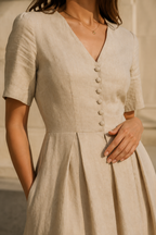 Sand linen a-line midi dress, fabric detail, crumpled flax texture in raking light