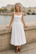White linen a-line midi dress, front view, straight neckline and spaghetti straps