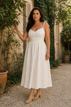Ivory linen a-line midi dress, lifestyle, seaside stroll in warm light