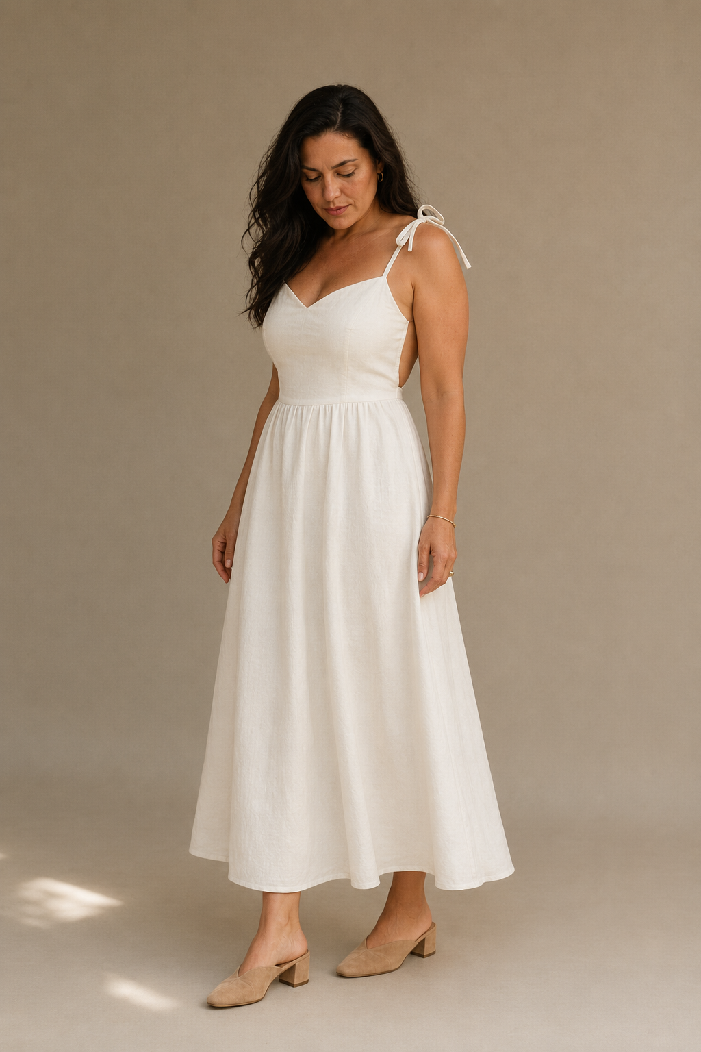 Ivory linen a-line midi dress, three-quarter view, flowing linen drape and midi length