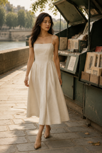 Ivory linen a-line midi dress, lifestyle, sunlit room, quiet elegance