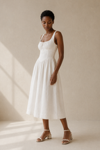 Ivory linen a-line midi dress, three-quarter view, side pockets and flowing skirt