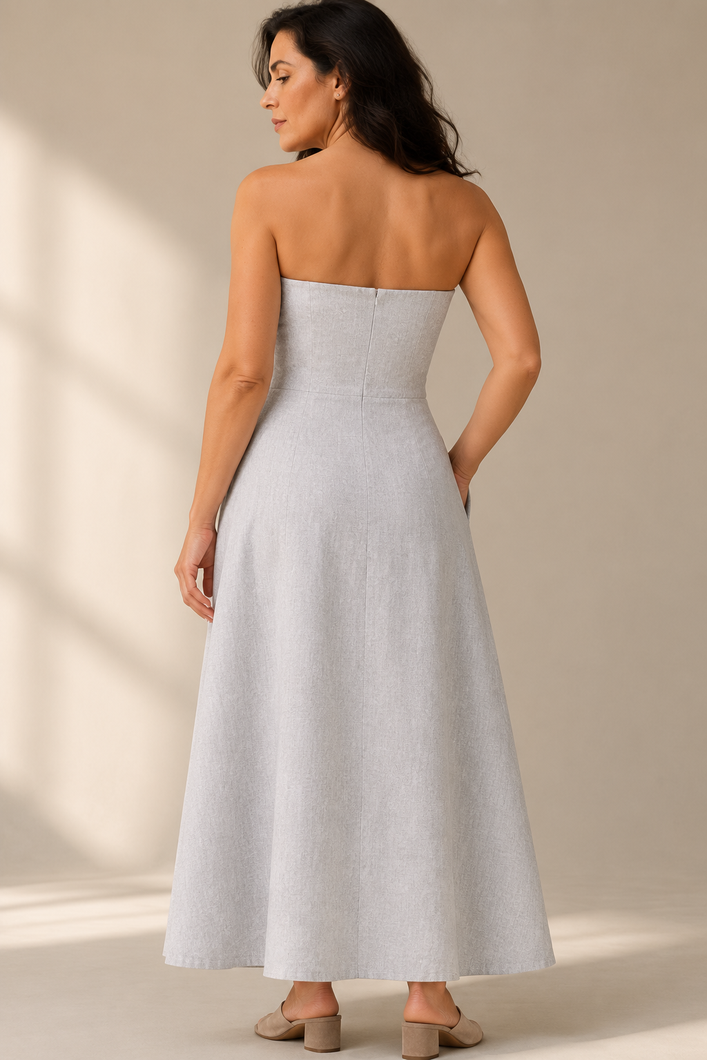 Light grey linen a-line midi dress, back view, fitted bodice and flowing midi skirt