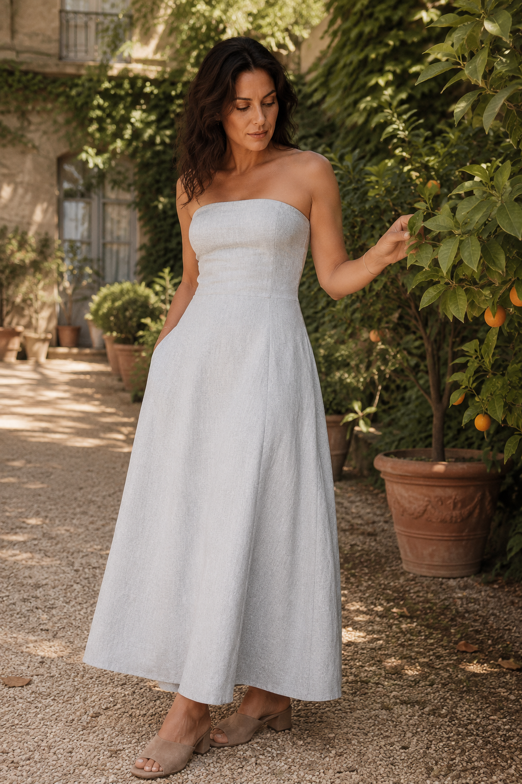 Light grey linen a-line midi dress, front view, strapless neckline and A-line midi silhouette
