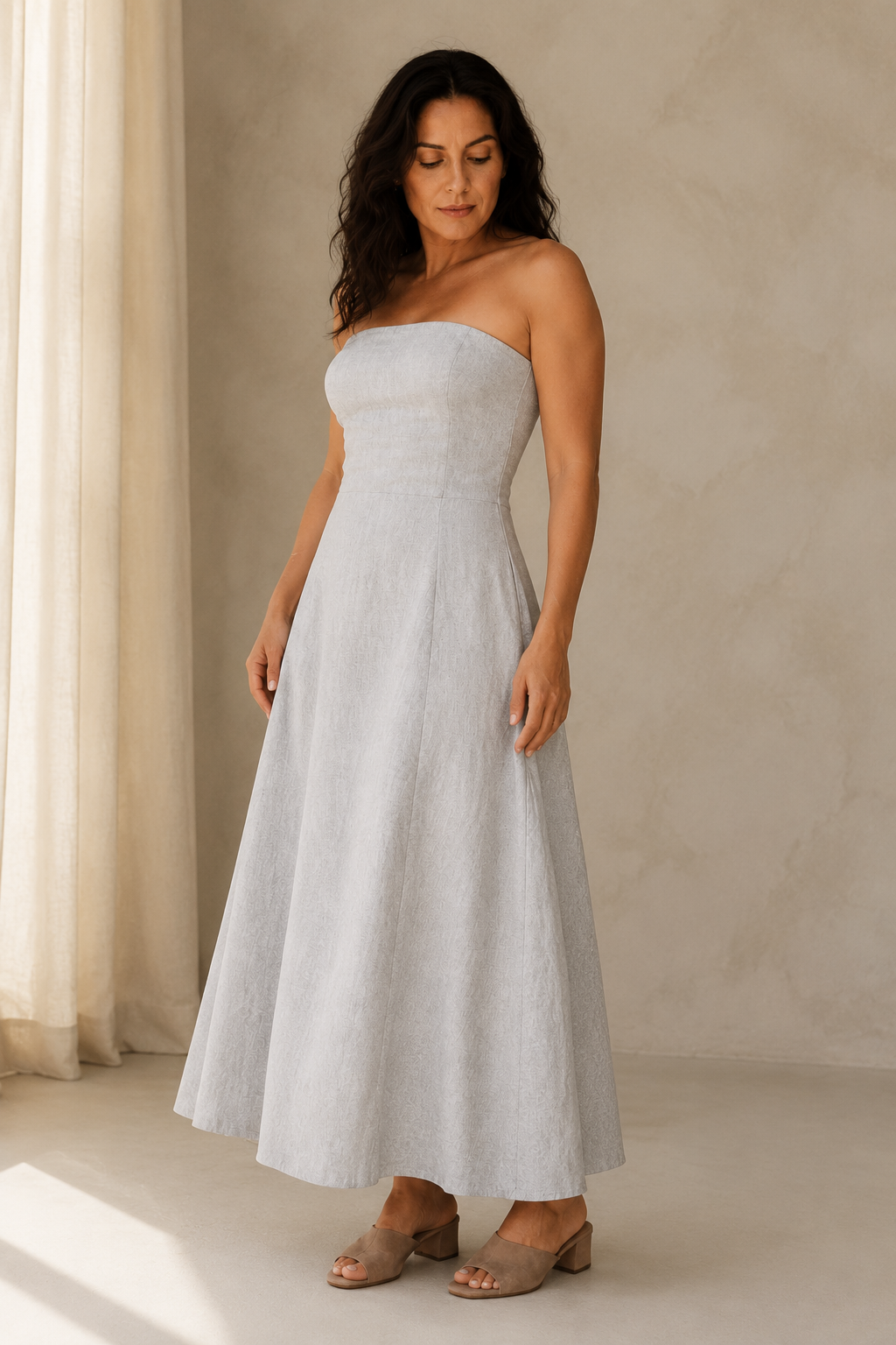 Light grey linen a-line midi dress, three-quarter view, a-line silhouette with natural fabric drape