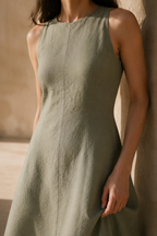 Sage green linen a-line midi dress, fabric detail, flax weave in raking light