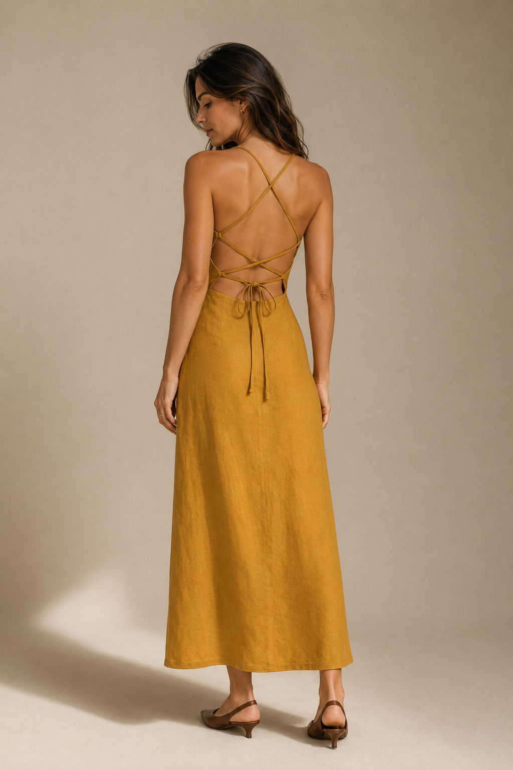Mustard yellow linen a-line midi dress, back view, fitted bodice and skirt release