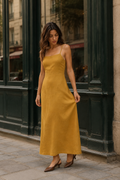 Mustard yellow linen a-line midi dress, front view, straight neckline and flowing A-line