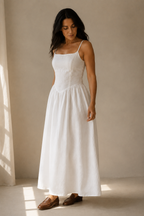 White linen a-line midi dress, three-quarter view, v-shaped waist and flowing skirt