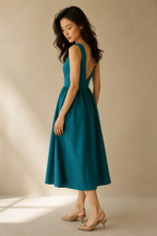 Teal linen a-line midi dress, three-quarter view, flowing skirt, defined waist