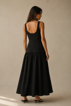 Black linen a-line midi dress, back view, u-shaped back and soft skirt release