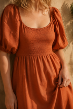Rust orange linen a-line midi dress, fabric detail, flax weave in raking light