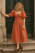 Rust orange linen a-line midi dress, front view, square neckline, smocked bodice, puff sleeves