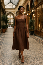 Brown linen a-line midi dress, lifestyle, daylight stroll in warm linen