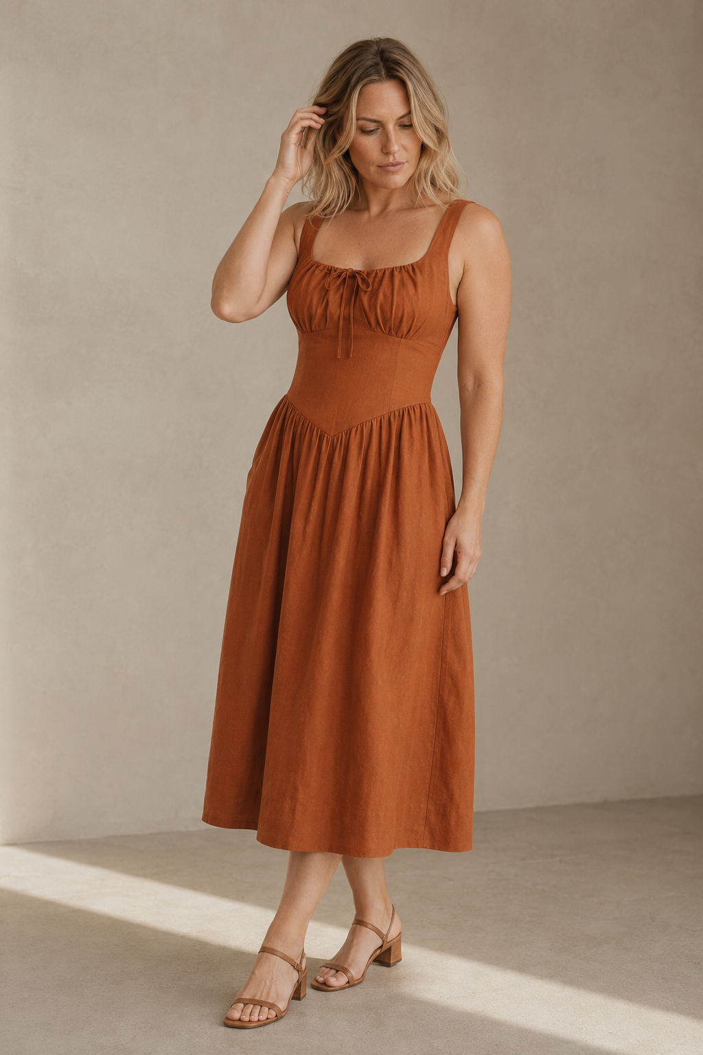 Rust linen a-line midi dress, three-quarter view, flowing skirt and comfortable silhouette
