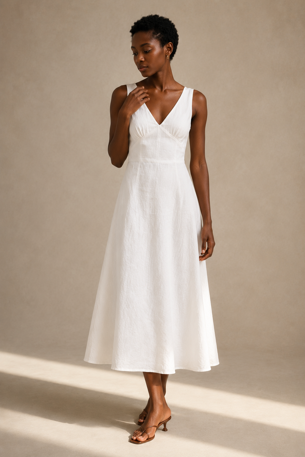 White linen a-line midi dress, full front view, fitted bodice, flowing A-line skirt