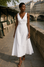 White linen a-line midi dress, lifestyle, strolling on a sunlit afternoon