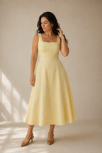 Butter yellow linen a-line midi dress, full front view, fitted bodice, paneled flared skirt
