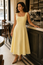 Butter yellow linen a-line midi dress, lifestyle, sunlit steps, quiet morning