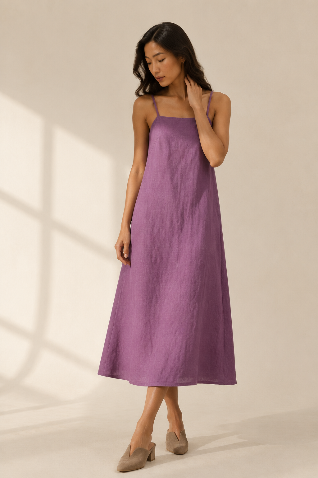 Purple linen slip midi dress, three-quarter view, gentle drape and flowing silhouette