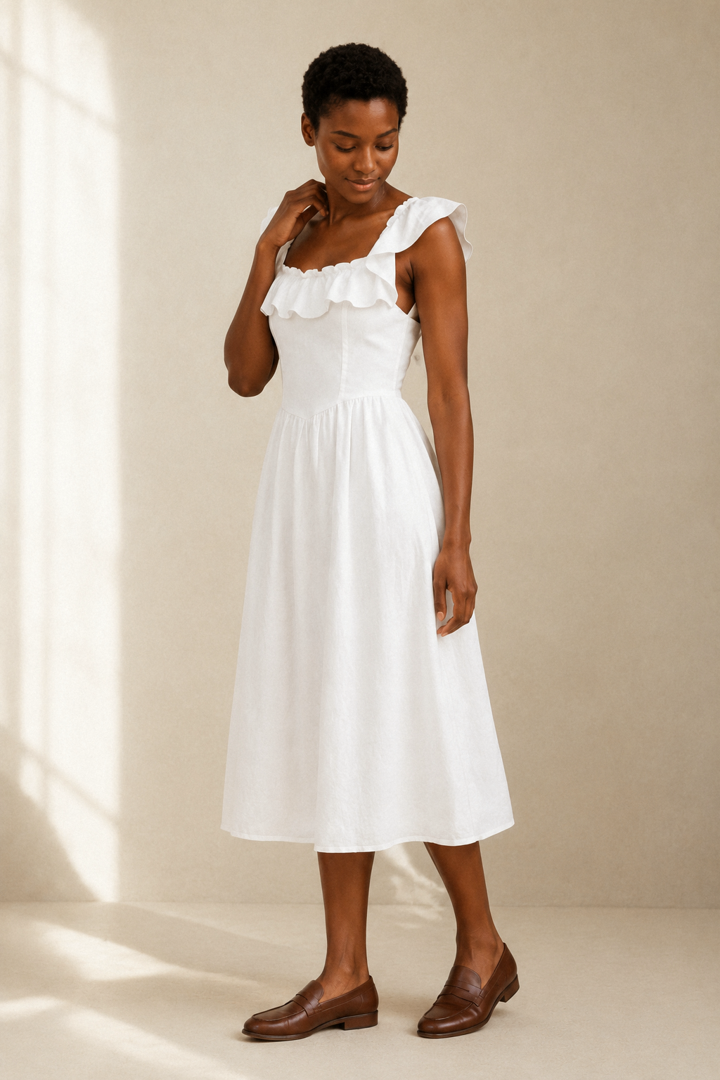 White linen a-line midi dress, three-quarter view, gathered waist seam and soft skirt drape