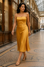 Golden yellow silk slip midi dress, lifestyle, relaxed moment indoors