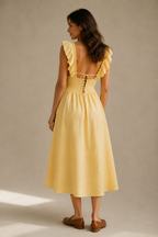 Butter yellow linen a-line midi dress, back view, fitted bodice, relaxed skirt