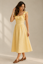 Butter yellow linen a-line midi dress, three-quarter view, soft linen drape, light movement