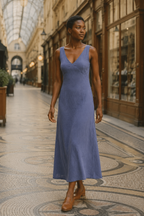Dusty blue linen a-line midi dress, lifestyle, relaxed setting with natural light