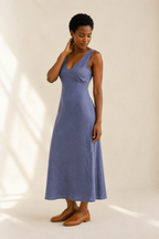 Dusty blue linen a-line midi dress, three-quarter view, a-line silhouette with graceful drape