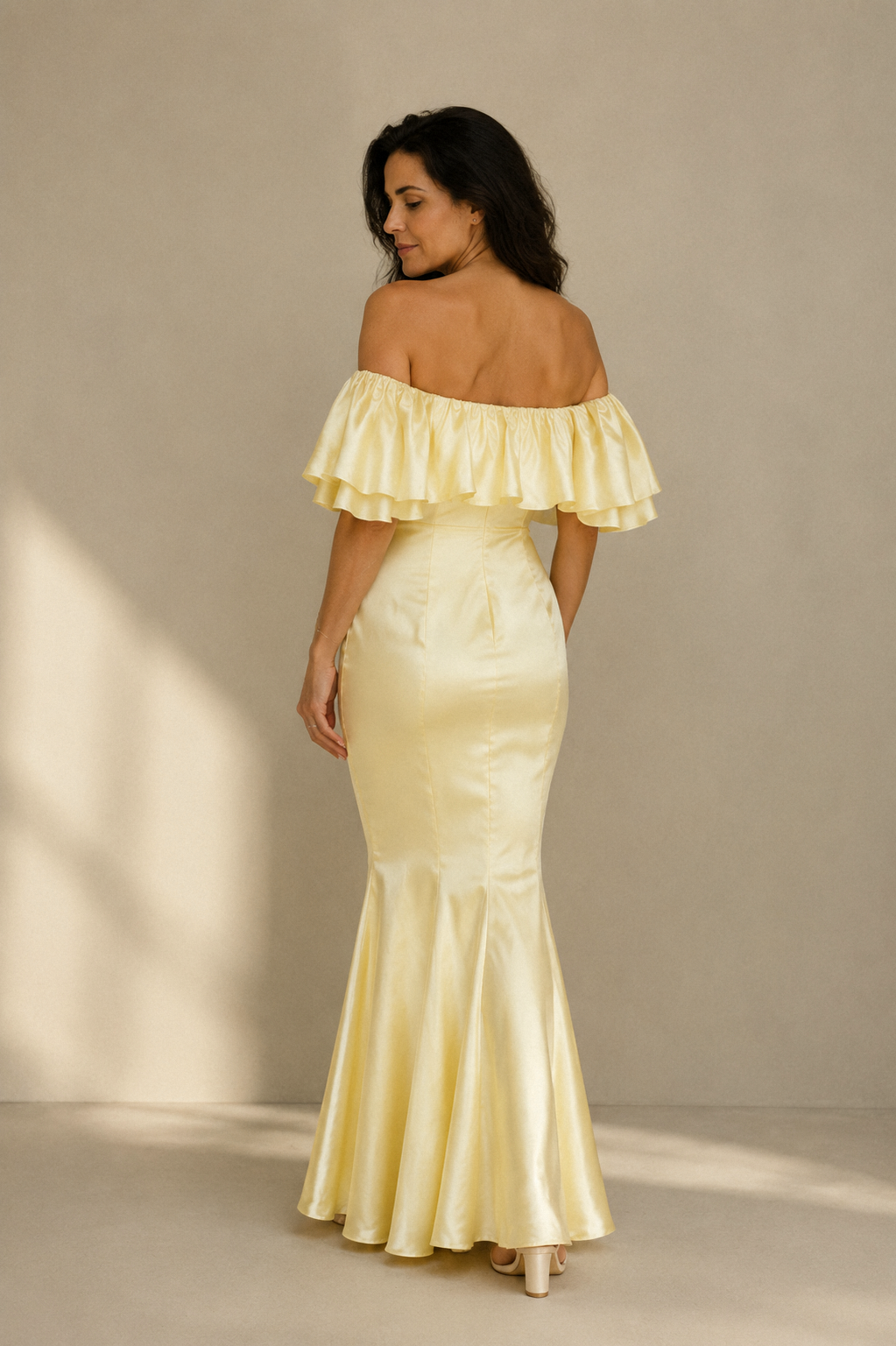 Butter yellow silk column midi dress, back view, ruffled off-shoulder and body-skimming silhouette